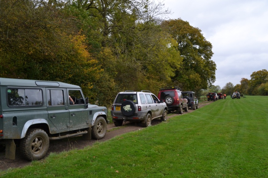 a long line of land rovers